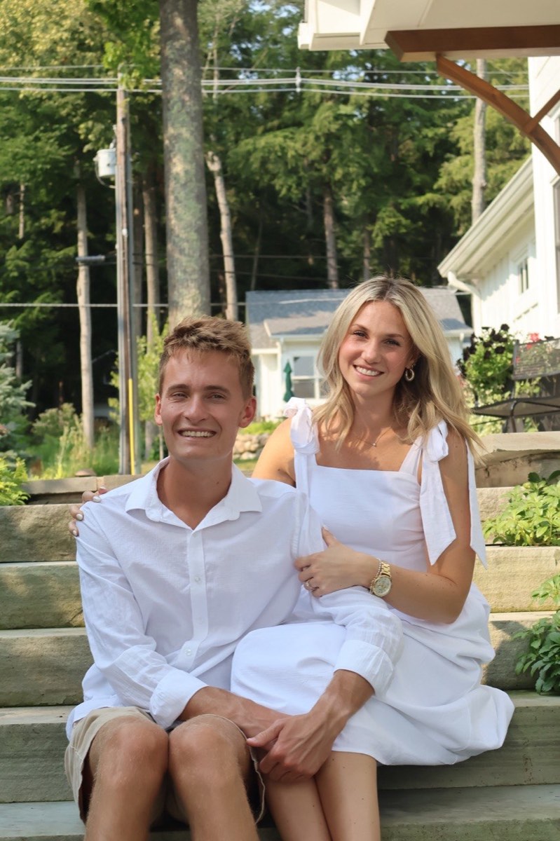 Tucker and Syd smiling together on garden steps