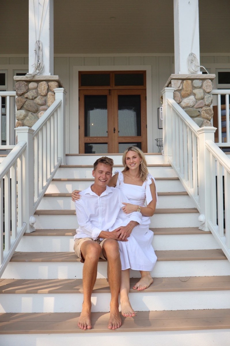 Tucker and Syd seated on the clubhouse steps