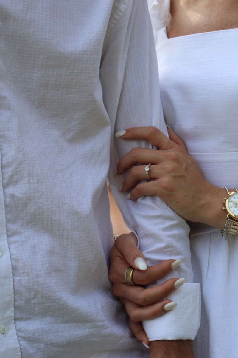 Syd’s engagement ring as she holds Tucker’s arm